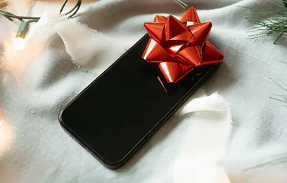 κινητό με κόκκινο φιόγκο