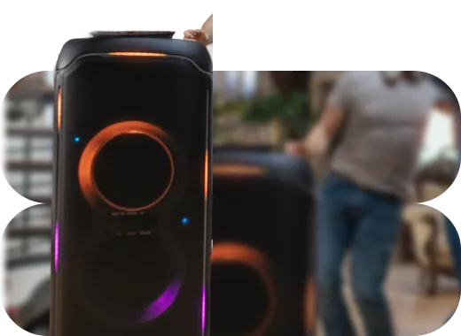 Party box σε πρώτο πλάνο και άνθρωποι που χορεύουν.